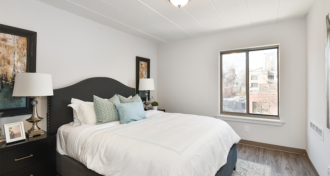 the bedroom with a hardwood floor